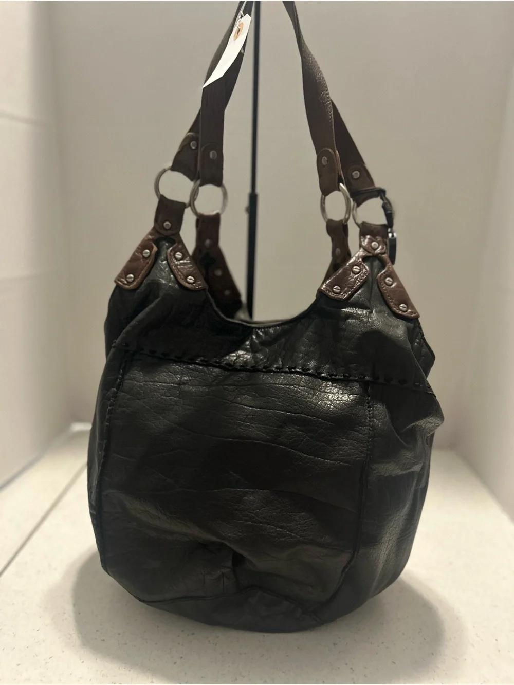 The Sak Black Leather Hobo Bag with Brown Trim